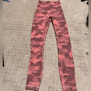 Lululemon size 2 women’s pink camo leggings.
